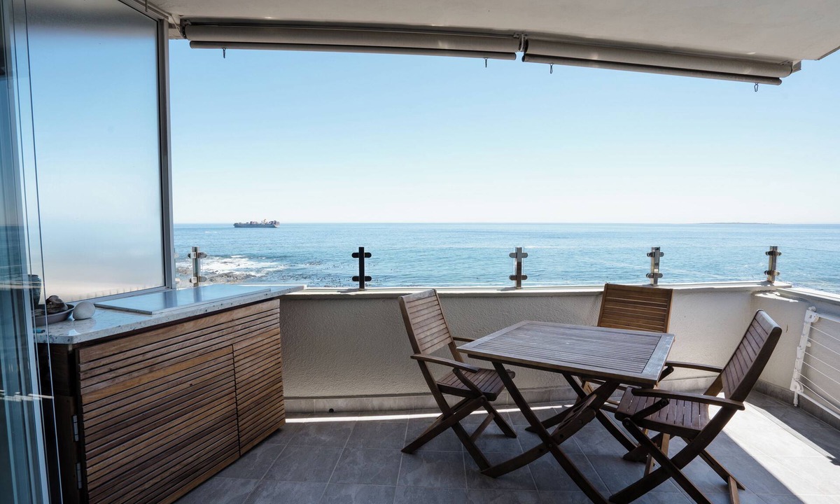 Three Anchor Bay Apartment | Modern Beachfront 3-bedroom apartment, mini gym, gas bbq, indoor fireplace.