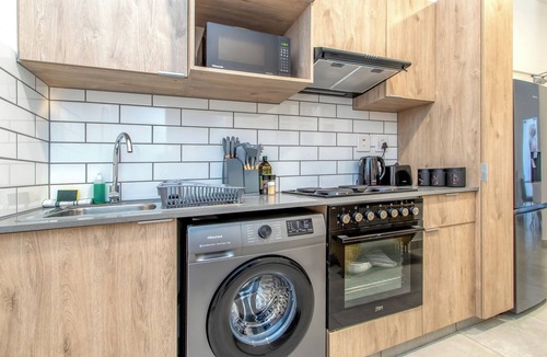 Greater Johannesburg Metropolitan Area Apartment | Chic 2BR in Illovo: Work, Play, Unwind