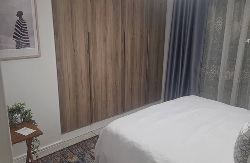 The Willows Apartment | Cozy 1-bedroom penthouse apartment in beautiful Pretoria with AC and gym
