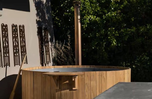 Stellenbosch Apartment | Enjoy the privacy of your own wood fired hot-tub, barbecue & breathtaking views.