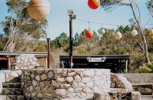 Pearly Beach RV Rental | Flow @ Tides Glamping is a secluded glamping retreat surrounded by trees.