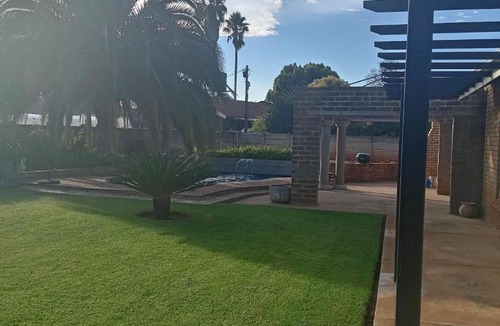 Mahikeng House | Luxurious 4-Bedroom House Rental with Pool Access in Ngaka Modiri Molema