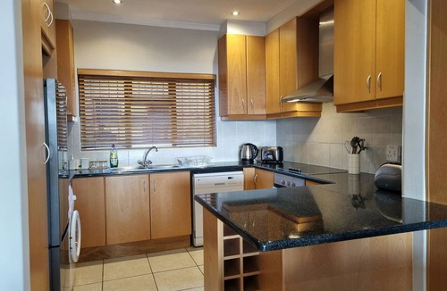 Gordons Bay Central Apartment | Perfect Sea View 2-bedroom apartment with AC on Gordon's Bay's Beach front