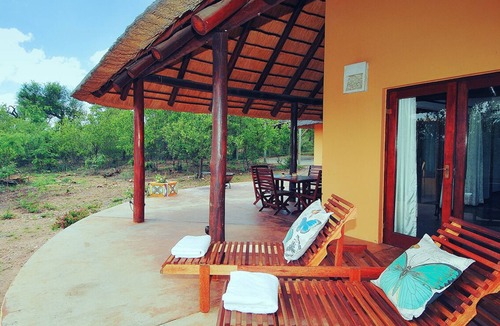 Phalaborwa House | Safari Lodge in Kruger National Park with a waterhole and a hot tub