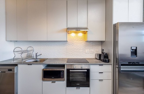 Milnerton Apartment | Urban Chic Retreat Stunning Mountain Views by CTHA