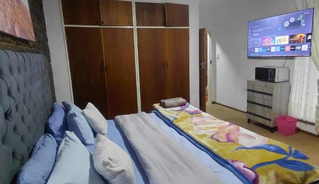 Bed & Shared Bath by Mama R in Newcastle