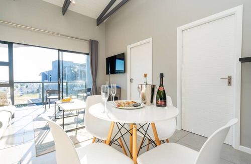 Mykonos Apartment | Stylish Urban Stay | Balcony | Braai Area