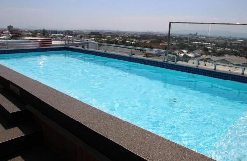 Observatory Apartment | Trendy Bachelor Pad Free Parking Rooftop Pool