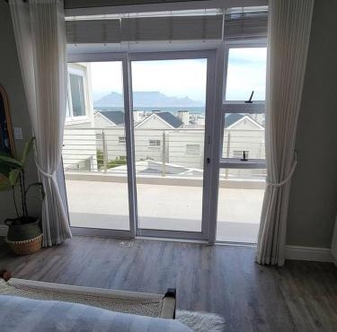 Big Bay Bliss, Ocean And Mountain Views in Cape Town